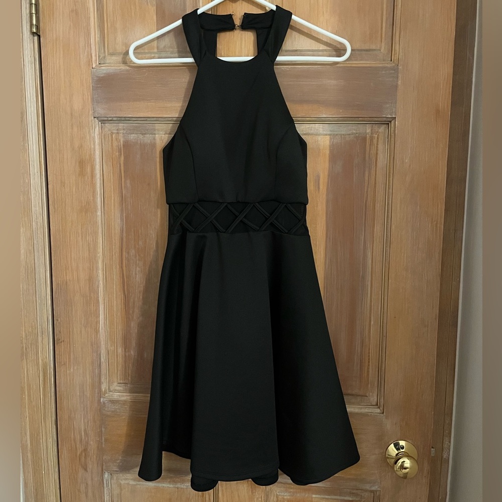 Black dress, mesh in the middle section, halter neck, skater dress.